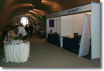 picture of the hall with waiters serving to a table