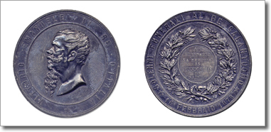 medaglia con profilo del re e rami di alloro e quercia annodati
